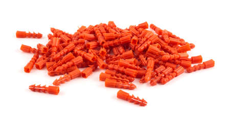 Red plastic dowel pin pile isolated over white backgroundの写真素材