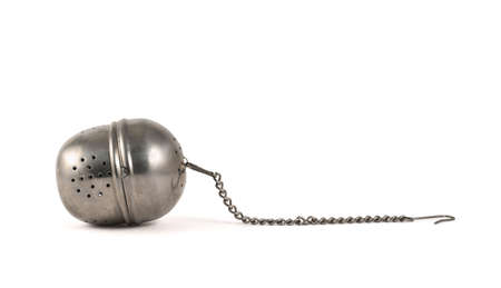 Metallic tea strainer infuser isolated over white backgroundの写真素材