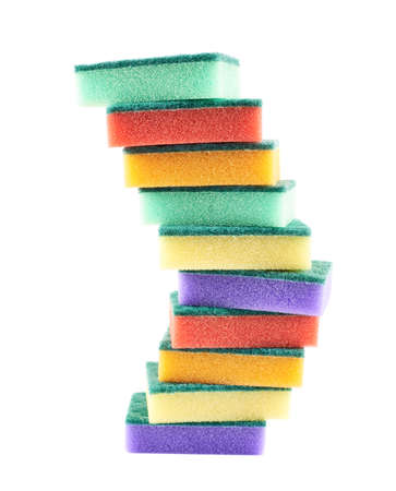Pile of kitchen colorful sponges composition isolated over white backgroundの写真素材