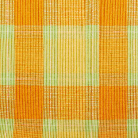 Cloth orange fabric mat as abstract texture background composition, top view above