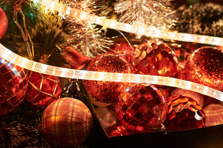 Festive Christmas background as a xmas decorations hightlightened with a garlandの写真素材