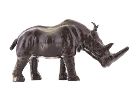 Rhinoceros rhino sculpture made of black leather isolated over white backgroundの写真素材