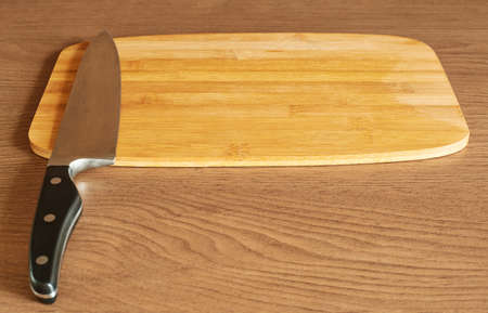 Cutting board and cook's knife indoor compositionの写真素材