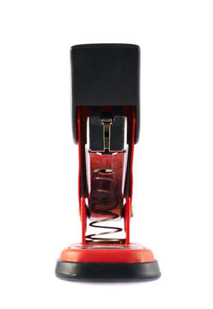 Red office stapler isolated over white background, front view, shallow depth of fieldの写真素材