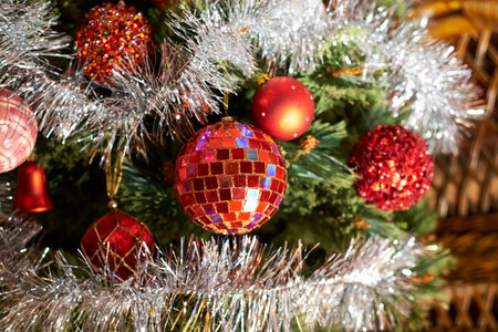Seasonal Christmas decoration background as a fragment of a decorated with balls xmas tree