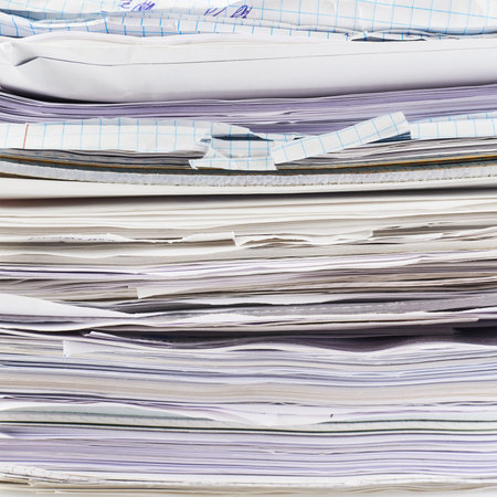 Stack of paper sheets and documents fragment as a business background