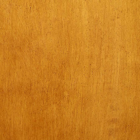 Varnished wooden surface fragment as a texture backgroundの写真素材