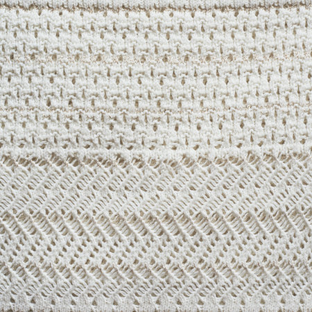 Knitted white cloth material fragment as a background texture