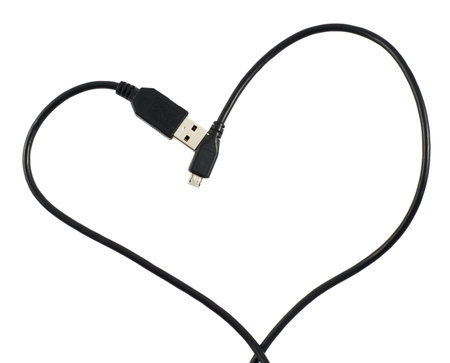USB cable shaped as a heart composition over white backgroundの写真素材