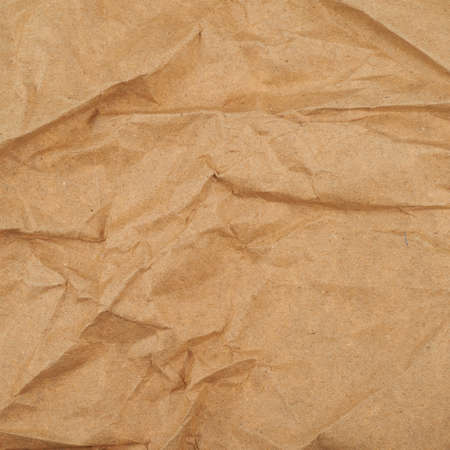 Creased cheap brown packaging paper texture backgroundの写真素材