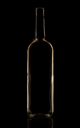 Glass bottle in the low-key lighting and surface reflectionの写真素材