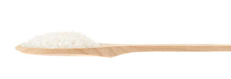 Wooden spoon full of salt crystals isolated over the white background, side viewの写真素材