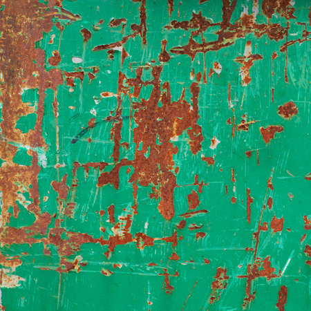 Painted green rusty metal surface composition as a background textureの写真素材