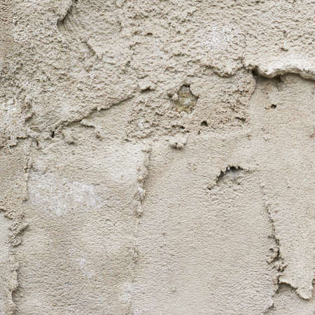 Old cement wall fragment as a grunge background textureの写真素材