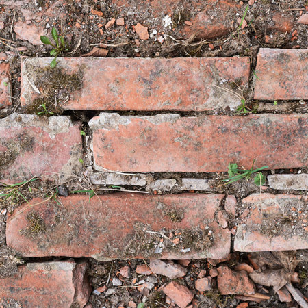Old red brick wall fragment as a background texture