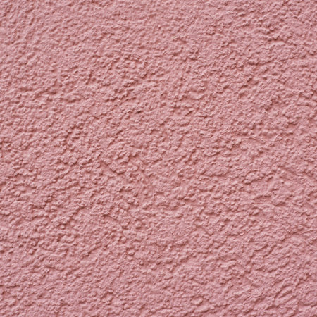 Carnation pink colored wall fragment as a background texture
