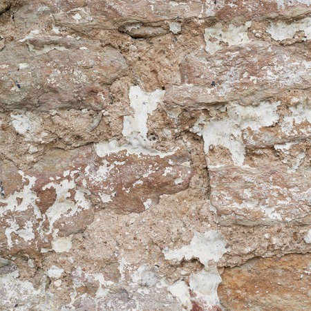 Old brick castle's wall fragment as a background texture