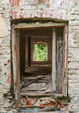 Shot of an old abandoned building through the doorwaysの写真素材
