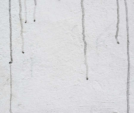 Old wall with a black dirt stains fragment as an abstract background compositionの写真素材