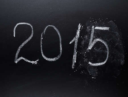 Year number 2015 written with the white chalk on the blackboardの写真素材