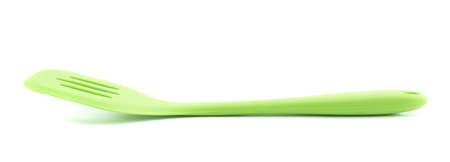 Green cooking silicone spatula isolated over the white backgroundの写真素材