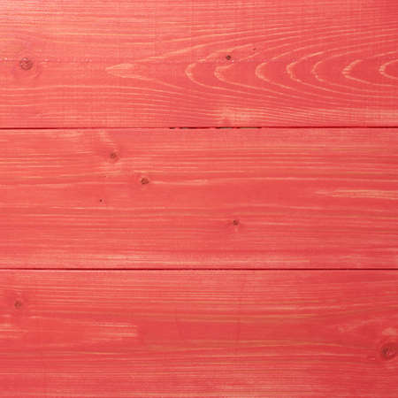 Recently painted in red wooden pine boards as a background texture compositionの写真素材