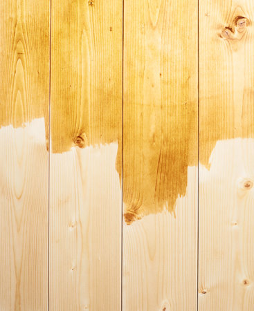 Half painted yellow wooden boards as a background compositionの写真素材