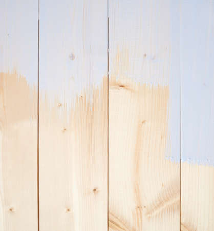Half painted white wooden boards as a background compositionの写真素材