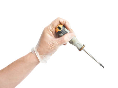 Hand in a rubber glove holding screwdriver, isolated over the white backgroundの写真素材