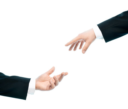 Two caucasian male hands composition of giving a hand of help, high-key light composition isolated...
