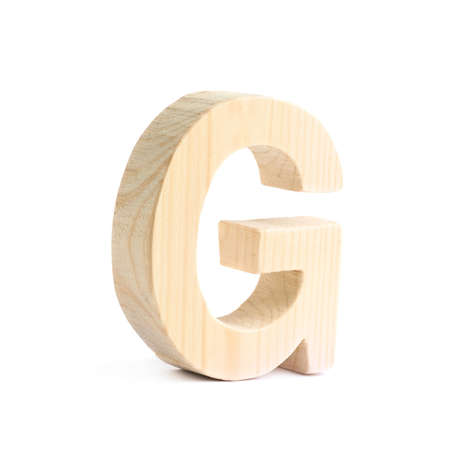 Wooden block G letter isolated over the white backgroundの写真素材