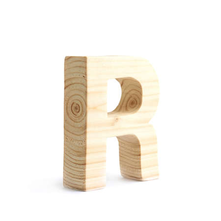 Wooden block R letter isolated over the white backgroundの写真素材