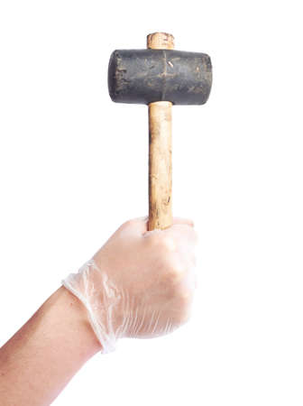 Worker's caucasian male hand in a dirty rubber glove holding a rubber mallet hammer tool, composition isolated over the white backgroundの写真素材