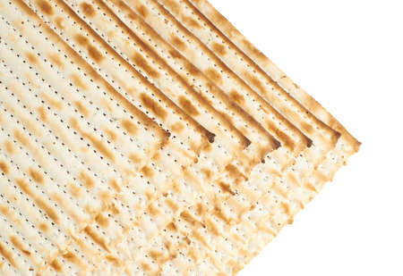 Multiple machine made matza flatbreads lying one over another as a background compositionの写真素材