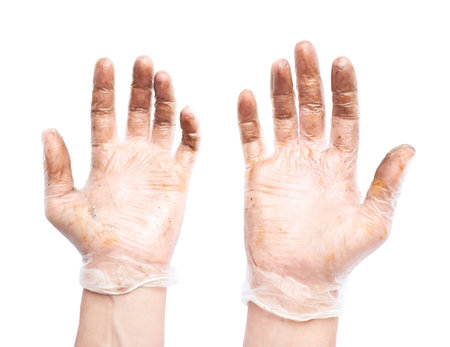 Pair of worker's hands in a dirty rubber gloves, composition isolated over the white backgroundの写真素材