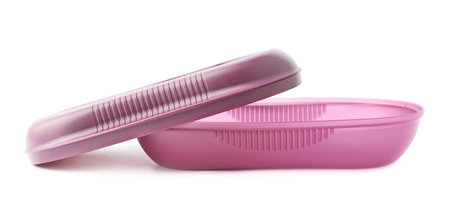 Violet plastic tableware food container with a cap, composition isolated over the white background