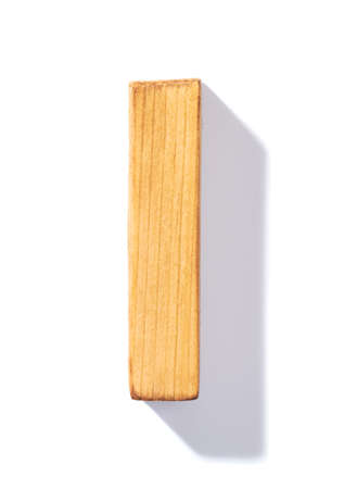 Single brown wooden I letter with 45 degree long shadow as a real life flat design font, isolated over the white backgroundの写真素材