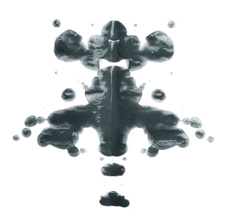 Symmetric abstract paint blot as in a Rorschach test isolated over the white backgroundの写真素材