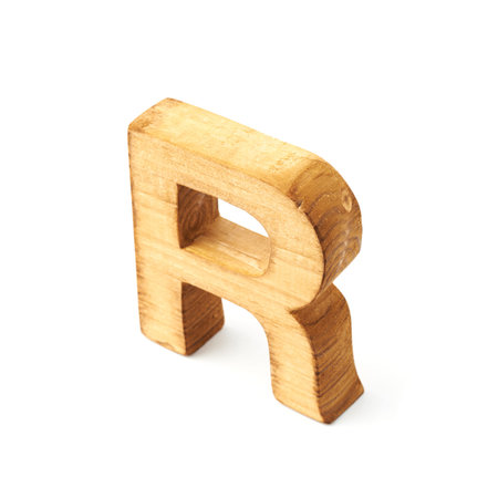 Single capital block wooden letter R isolated over the white backgroundの写真素材