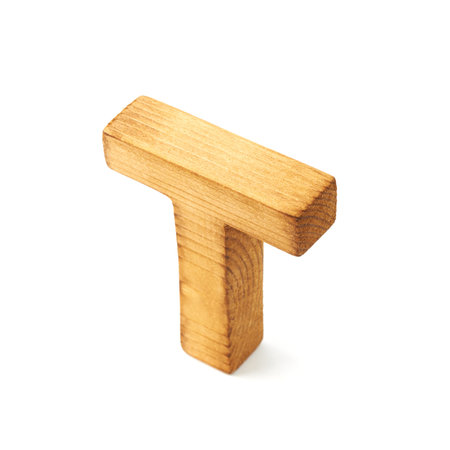 Single capital block wooden letter T isolated over the white backgroundの写真素材