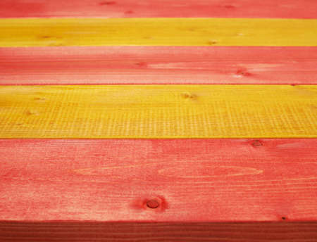 Colorful paint coated pine wood boards fragment as a background compositionの写真素材