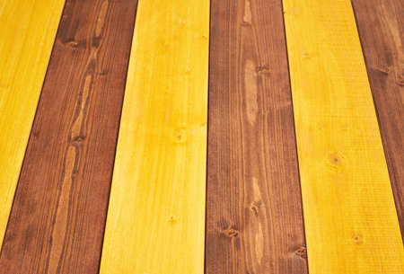 Colorful paint coated pine wood boards fragment as a background composition with a shallow depth of fieldの写真素材