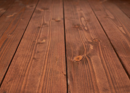 Surface covered with the multiple brown paint coated pine wood boards as a shallow depth of field...