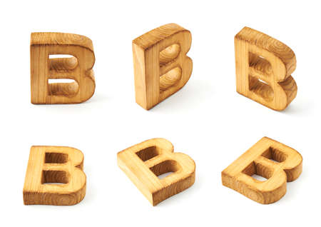 Set of six block wooden capital B letters in different foreshortenings isolated over the white backgroundの写真素材