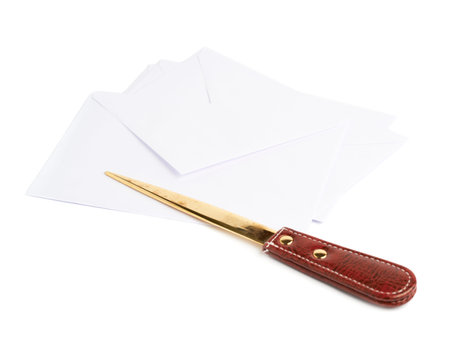 Special red leather knife next to a pile of white envelopes, composition isolated over the white backgroundの写真素材