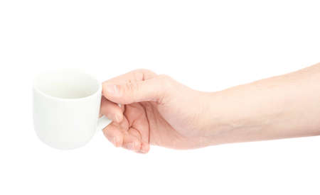 Male hand holding the white ceramic coffee cup, composition isolated over the white backgroundの写真素材