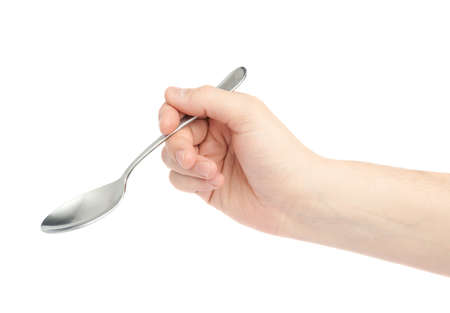 Male hand holding an empty spoon, composition isolated over the white backgroundの写真素材