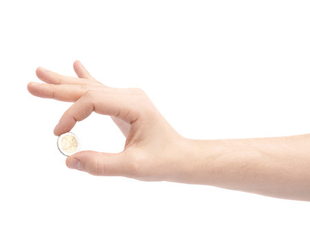 Hand holding two euro coin, composition isolated over the white background