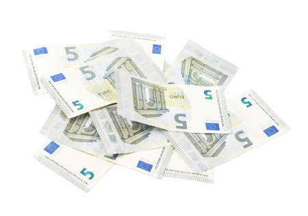 Pile of multiple five euro bank note bills, composition isolated over the white backgroundの写真素材