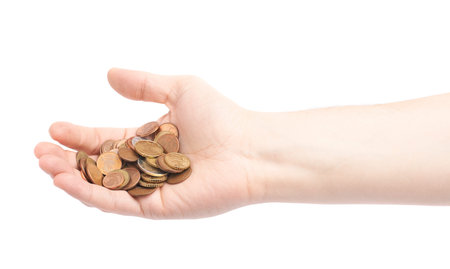 Hand holding a pile of euro coins, composition isolated over the white background